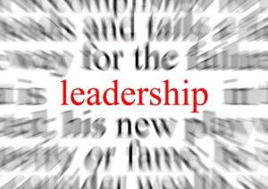 Blurred text with a focus on leadership